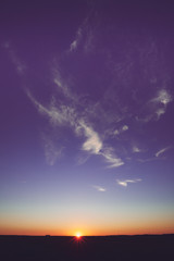 Sunset, Sunrise, Sun Over Rural Countryside Field. Bright Violet