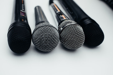 Obraz premium Microphone on white background, black, silver, different