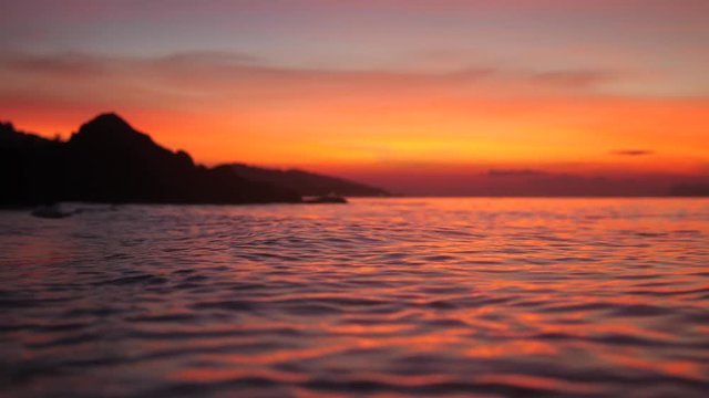 Beautiful sunset over tropical beach, amazing red colors. Thailand. slow motion. 3840x2160
