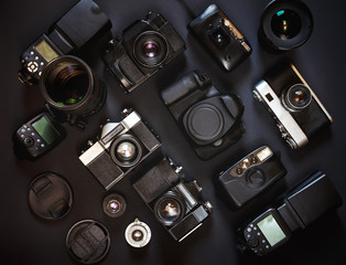 Photograph Workplace Concept. Collection Vintage Film And Digital Cameras, On Black Background, Top...