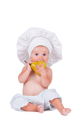 Cheerful little child with a pear in his hands in a chef suit on a white background.