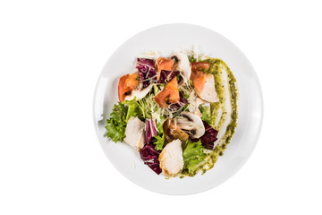 Salad in taller isolated on white background. Top view.