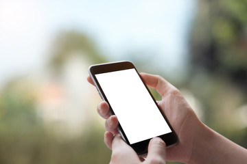 Smart phone showing blank screen in man hand with light bokeh Background