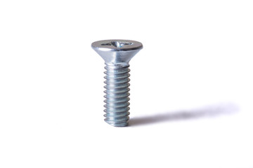 Винт с гайкой на белом фоне. Изолят. The screw with a nut on a white...