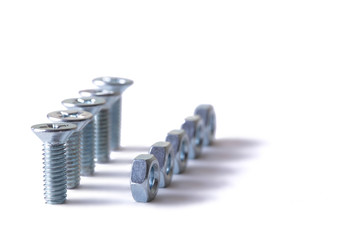 Винт с гайкой на белом фоне. Изолят. The screw with a nut on a white...
