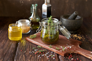 Vinaigrette dressing for salad. French cuisine. Olive oil, wine vinegar, honey, mustard and herbs ingredients
