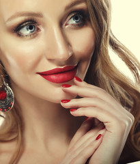 Woman with lips mouth red   lip and blonde curly hair portrait. 