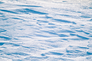 Fototapeta premium Beautiful fresh snow pattern in minimalistic style. Winter background. Norway, Northern Europe. Close up texture