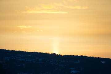 A beautiful colorful winter sunset in a central Norway. Warm evening light over the mountains.