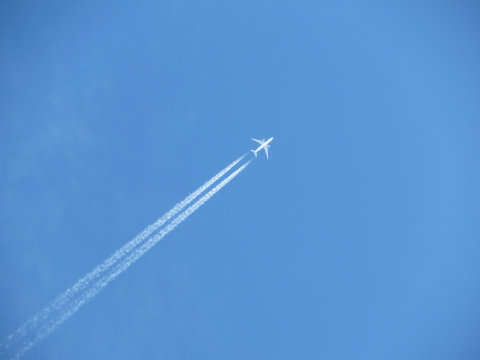 Jet Airplane With Contrail. Trace Of The High Flying Plane In The Blue Sky 