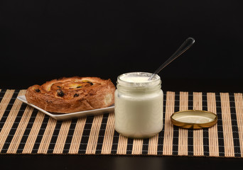 Delicious French raisin buns and yogurt for breakfast