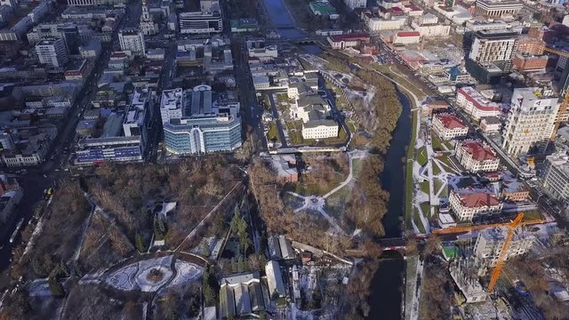 Aerial view of a modern and clean city with lots greenery and white buildings. Clip. Top view of the modern city with greenery