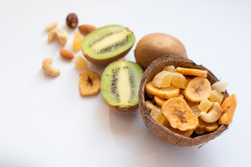 Kiwi and dried fruits in coconut shel