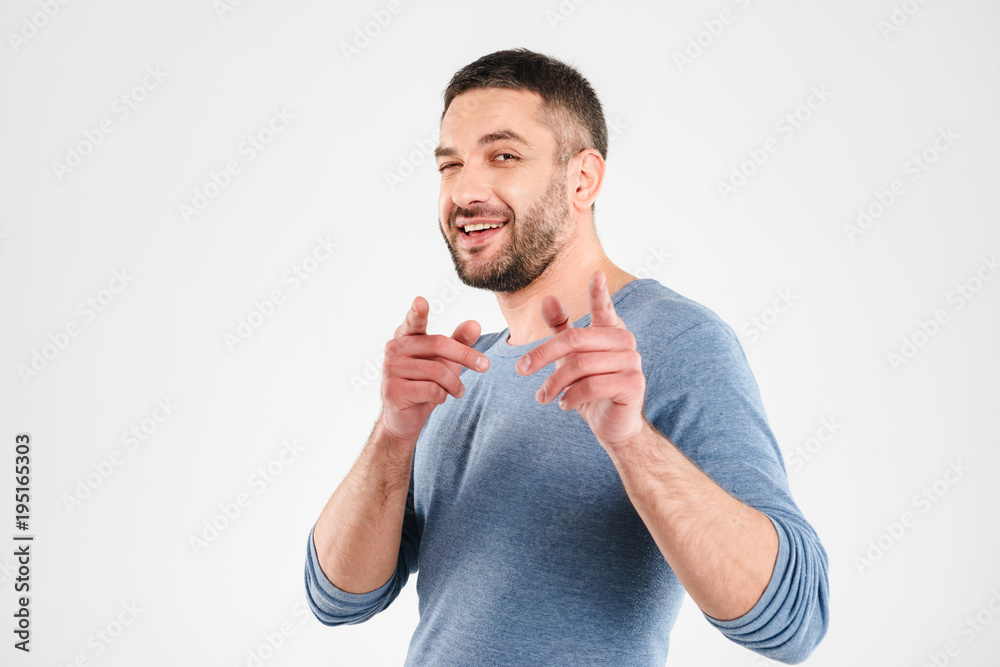 Canvas Prints Happy young man pointing.