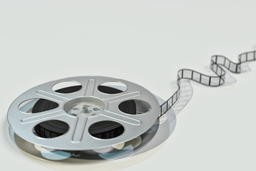 Obraz premium Film Reel and film strip on light gray background - 3d illustration