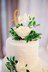 White Wedding Cake With Love Word