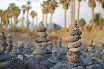 Several pebbles stacked up in a beach