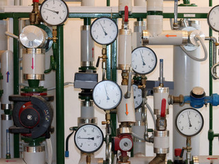 Sensors and devices indicating the parameters of hot water in the heating system of a large house....