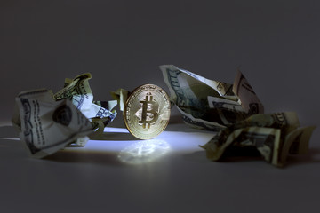 Bitcoin among crumpled dollar bills.