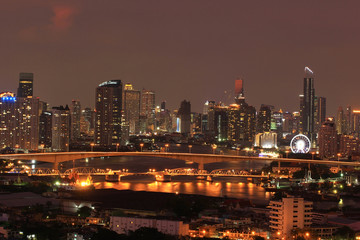 Fototapeta premium Over the night scene city on beautiful twilight sunset in bangkok city, Thailand