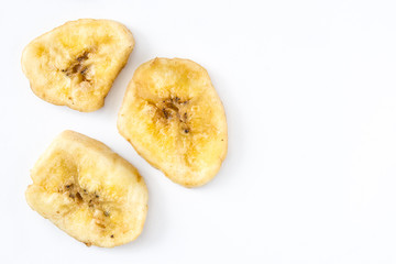 Close up banana chips isolated on white background. Top view. Copyspace