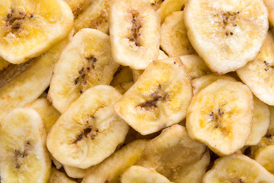 Banana chips background. Top view