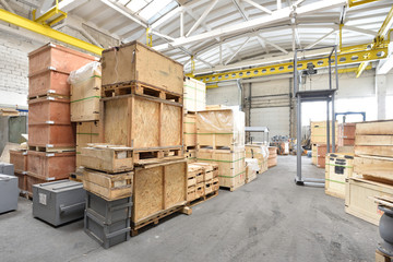 Large and light warehouse, cargo storage in wooden boxes