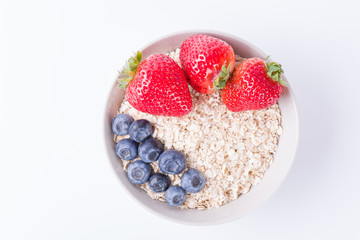 Bowl of oatmeal with berries. Delicious oatmeal with fresh fruit. Oatmeal. Breakfast, fruit.