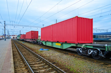 Fototapeta na wymiar Transportation of cargoes by rail in containers. Railway infrastructure background
