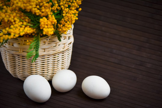 Basket of mimosa with Easter eggsBasket of mimosa with Easter eggs