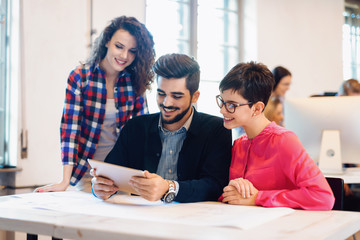 Picture of young architects discussing in office