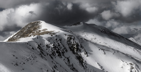 Dramatic winter storm clouds over Peak 4 at Breckenridge in the Rocky Mountains, Colorado