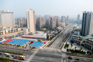aerial view of the district in Shanghai with roads and high-rise buildings