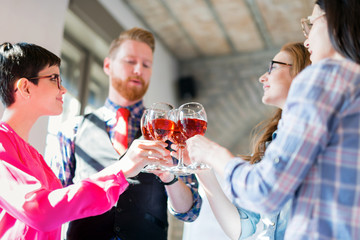 Office colleagues celebrating achievement of company goals