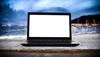 laptop on beach and free space for your decoration. 
