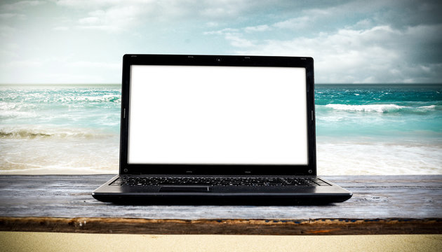 laptop on beach and free space for your decoration. © magdal3na