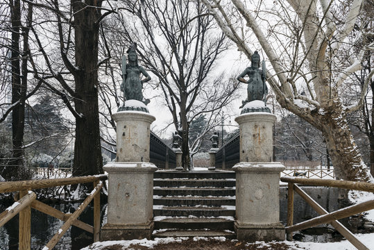 Mermaids bridge at Sempione Park in Milan, Italy. The four mermaid statues on the Ponte delle Sirenette in Milano during the winter.