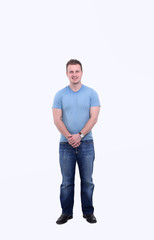 full-sized portrait.the guy in jeans and a t-shirt.