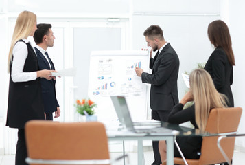 businessman makes a presentation to his business team