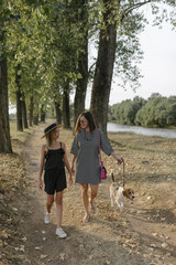 Fototapeta premium Two sisters spending quality time bonding outdoors