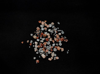 Pink salt crystals from Himalaya on black background