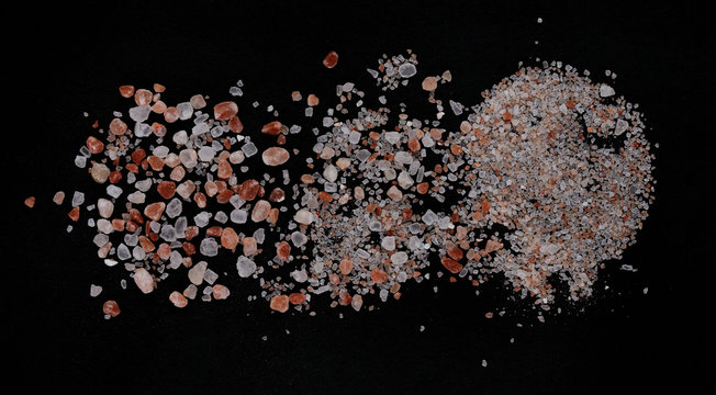Pink salt crystals from Himalaya on black background