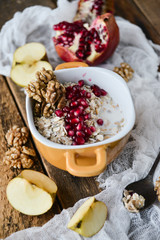 Healthy and healthy Breakfast: muesli, pomegranate, nuts. The concept of healthy eating.