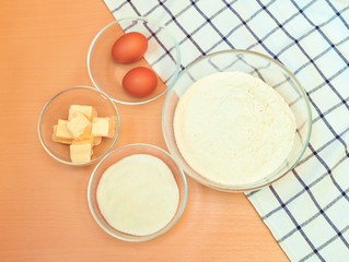 Flour, eggs, sugar, butter to make cake. Top view.