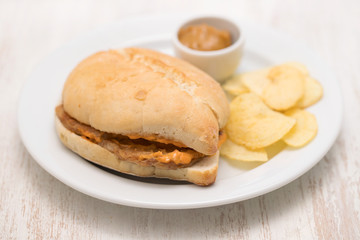 sandwich with meat  and potato on plate