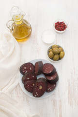 portuguese blood sausage on white plate