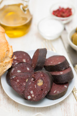 portuguese blood sausage on white plate