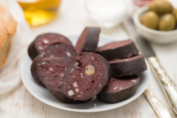 portuguese blood sausage on white plate
