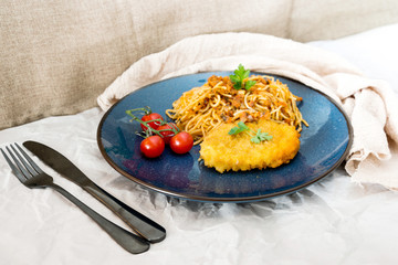 Escalope of spaghetti with tomatoes sauce and basil