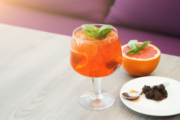 Modern serving of italian spritz with orange slices